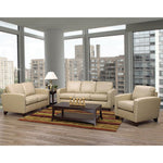 Beige living room furniture set with a coffee table in a room with large windows.
