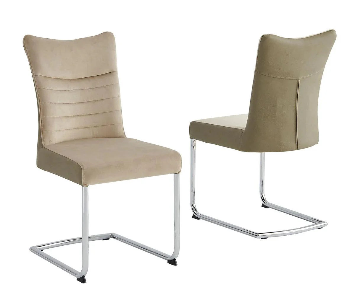 Two beige chairs with metal legs on a white background
